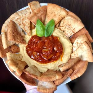 Hummus with balsamic tomato jam and pita chips