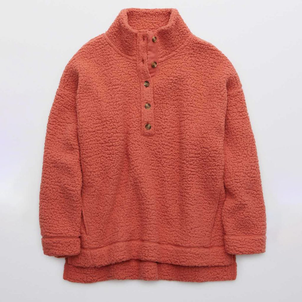 An Aerie Sherpa Oversized Pullover in rose.