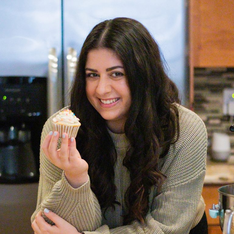 Jacklin posing with one of her cupcakes.