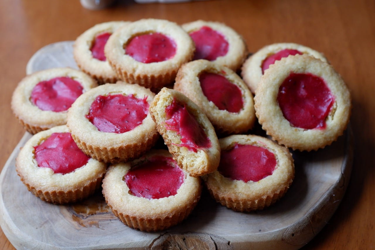 orange cookie cups with cranberry curd