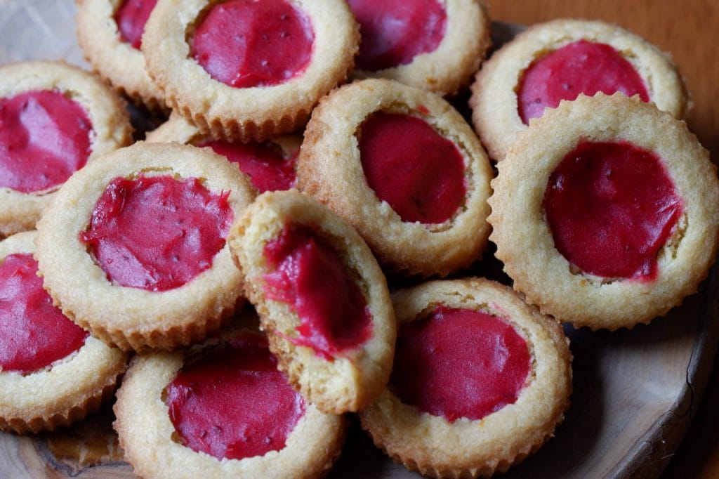 orange cookie cups with cranberry curd