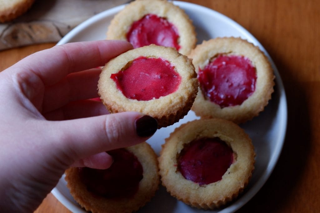 orange cookie cups with cranberry curd