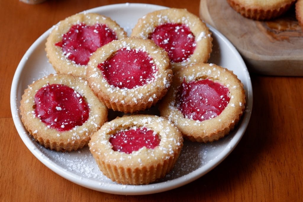 orange cookie cups with cranberry curd